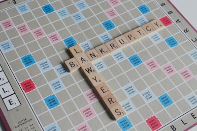 An image of a person standing on a path with a signpost showing two directions: one pointing to bankruptcy, symbolized by a sinking ship, and the other pointing to IVA, symbolized by a sturdy bridge leading to financial stability